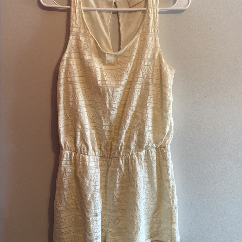 Cream lace romper, buckle open back, size medium, never worn, no tags
